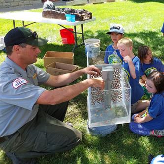 Trinidad Lake park ranger Kyle Sisco explains to students how the dam at Trinidad was built during the the annual water festival held at Trinidad State College, May 17-18, 2022.